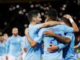 Manchester City's Ilkay Gundogan celebrates scoring their second goal with Riyad Mahrez and Raheem Sterling on September 18, 2019