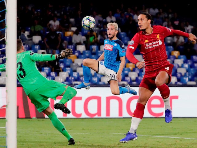 Napoli's Dries Mertens in action with Liverpool's Virgil van Dijk and Adrian on September 17, 2019