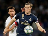 Real Madrid's Gareth Bale battles Paris Saint-Germain's Juan Bernat during their Champions League clash on September 18, 2019