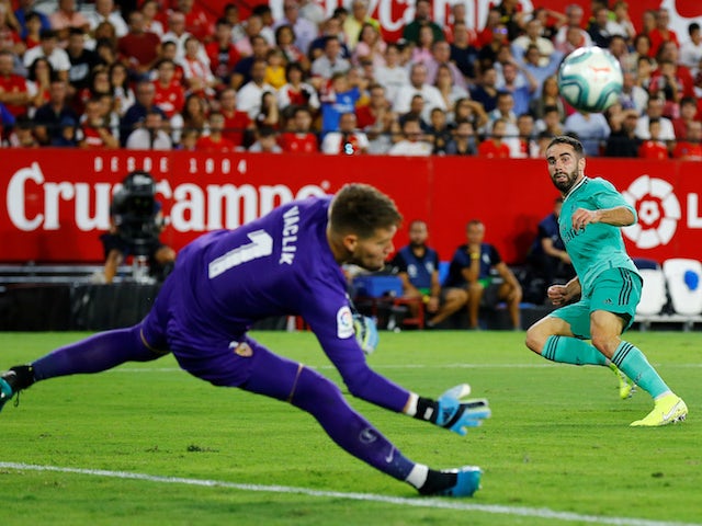 Real Madrid's Dani Carvajal tests Sevilla's Tomas Vaclik during their La Liga clash on September 22, 2019