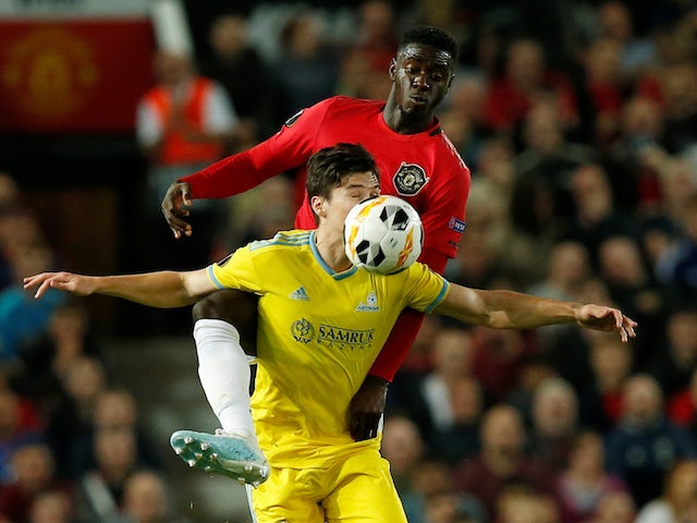 Manchester United's Axel Tuanzebe in action with Astana's Dorin Rotariu in the Europa League on September 19, 2019