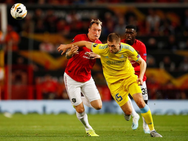 Manchester United's Phil Jones in action with Astana's Roman Murtazayev in the Europa League on September 19, 2019