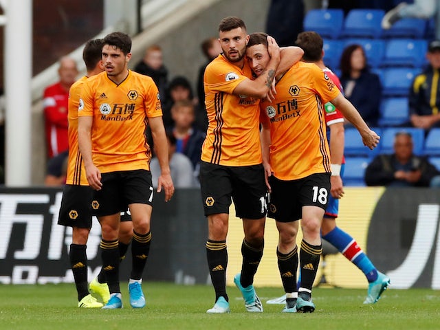 Wolverhampton Wanderers' Diogo Jota celebrates scoring their first goal with Patrick Cutrone and team mates on September 22, 2019