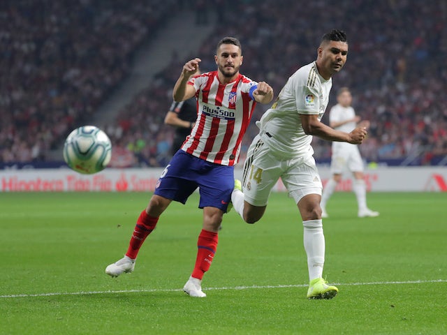 Real Madrid's Casemiro in action with Atletico Madrid's Koke in La Liga on September 28, 2019