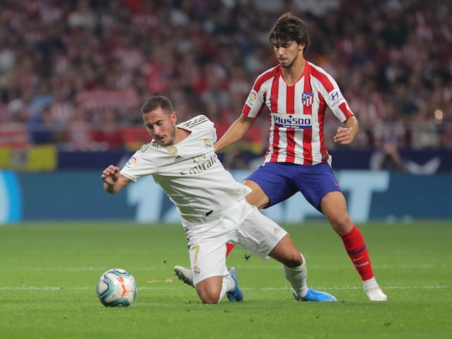 Real Madrid's Eden Hazard in action with Atletico Madrid's Joao Felix in La Liga on September 28, 2019