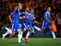 Colchester United players celebrate after winning the penalty shootout against Tottenham Hotspur on September 24, 2019