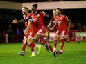 Crawley Town's David Sesay and teammates celebrate winning the penalty shootout against Stoke on September 24, 2019