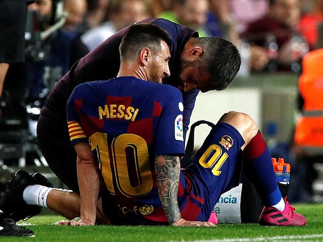 Barcelona's Lionel Messi is attended by medical staff after sustaining an injury against Villarreal on September 24, 2019