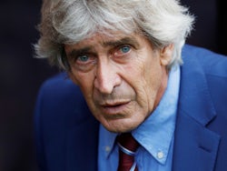 West Ham manager Manuel Pellegrini spots the camera on September 28, 2019