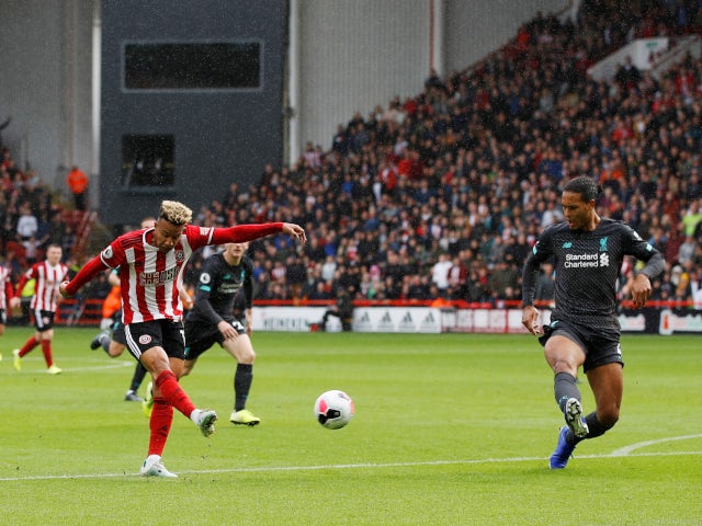 Sheffield United's Callum Robinson gets a shot away against Liverpool in the Premier League on September 28, 2019.