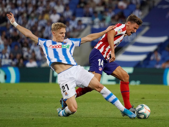 Real Sociedad's Martin Odegaard in action with Atletico Madrid's Marcos Llorente in La Liga on September 14, 2019