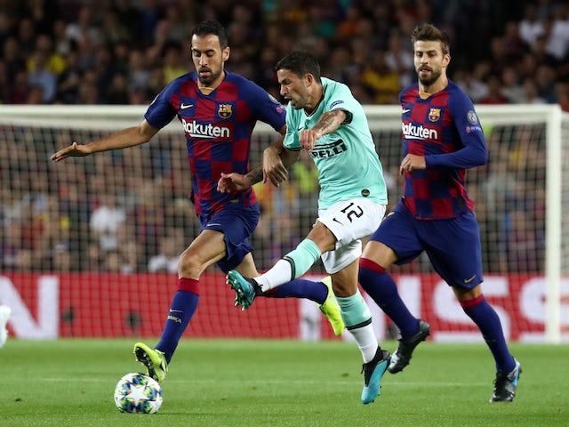 Barcelona's Sergio Busquets in action with Inter Milan's Stefano Sensi in the Champions League on October 2, 2019