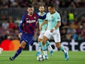 Inter Milan's Alexis Sanchez in action with Barcelona's Clement Lenglet in the Champions League on October 2, 2019