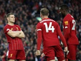Liverpool's James Milner celebrates scoring their second goal with Jordan Henderson and Divock Origi on October 5, 2019