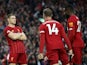 Liverpool's James Milner celebrates scoring their second goal with Jordan Henderson and Divock Origi on October 5, 2019