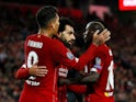 Liverpool's Mohamed Salah celebrates scoring their third goal with team mates on October 2, 2019