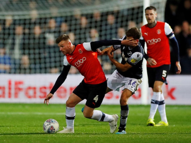 Luton Town's Ryan Tunnicliffe in action with Millwall's Jayson Molumby on October 2, 2019