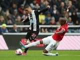 Manchester United's Ashley Young in action with Newcastle United's Miguel Almiron in the Premier League on October 6, 2019