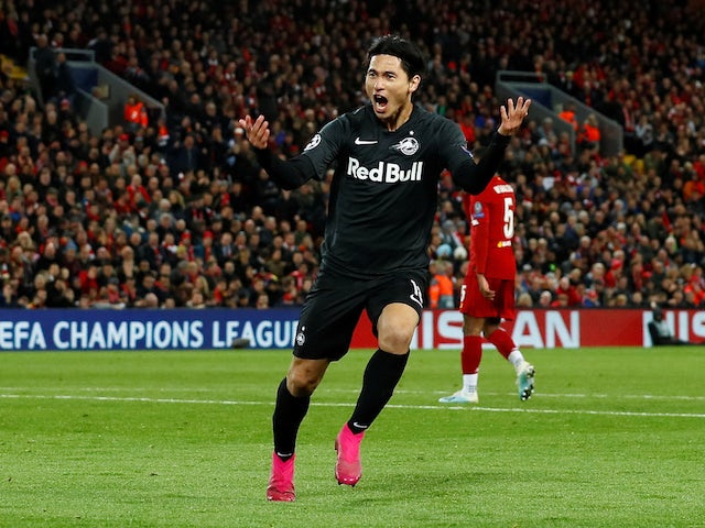 Salzburg's Takumi Minamino celebrates scoring their second goal against Liverpool on October 2, 2019