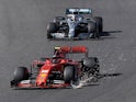 Ferrari's Charles Leclerc with a damaged front wing and Mercedes' Lewis Hamilton in action during the race