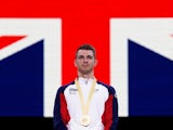 Gold medalist Britain's Max Whitlock celebrates on the podium on October 12, 2019