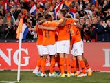 Netherlands' Memphis Depay celebrates scoring their third goal with teammates