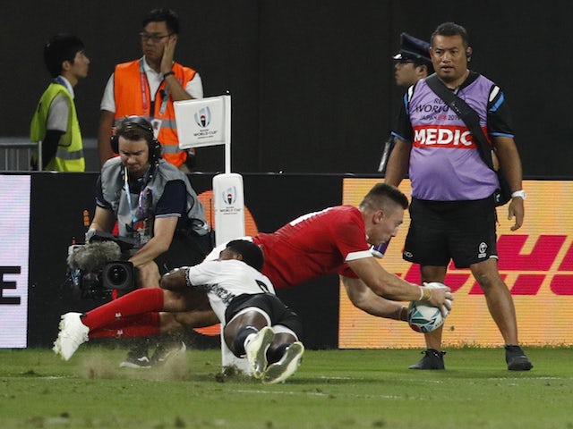 Wales survive Fiji scare to book quarter-final spot