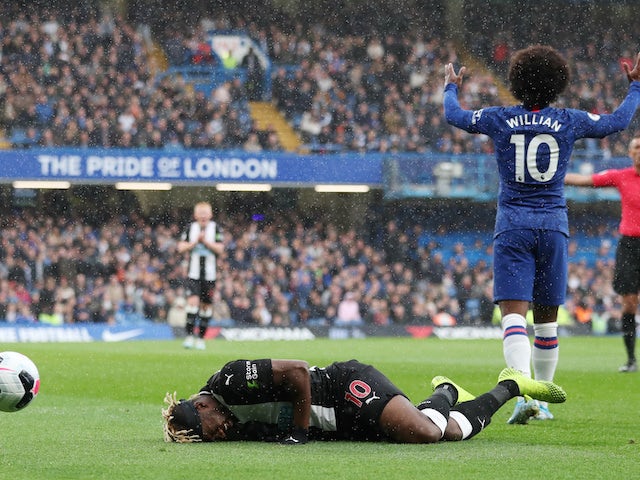 Allan Saint-Maximin and Willian in action during the Premier League game between Chelsea and Newcastle United on October 19, 2019