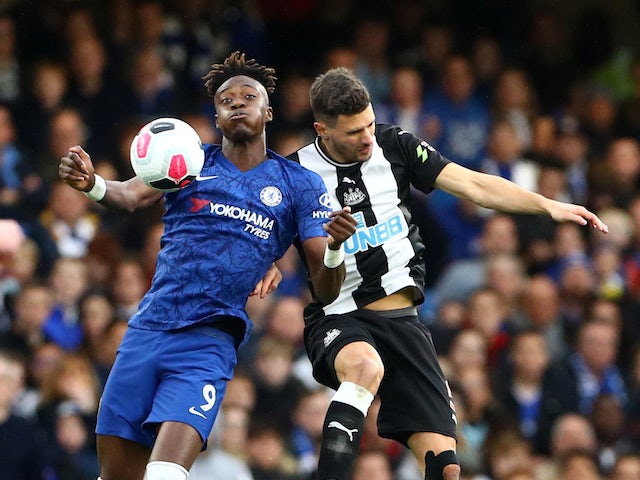 Tammy Abraham battles with Fabian Schar during the Premier League game between Chelsea and Newcastle United on October 19, 2019