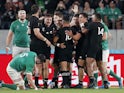 New Zealand's Aaron Smith celebrates with team mates scoring their first try on October 19, 2019