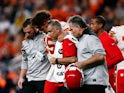 Kansas City Chiefs quarterback Patrick Mahomes (15) is helped off the field after a play in the second quarter against the Denver Broncos at Empower Field at Mile High on October 18, 2019