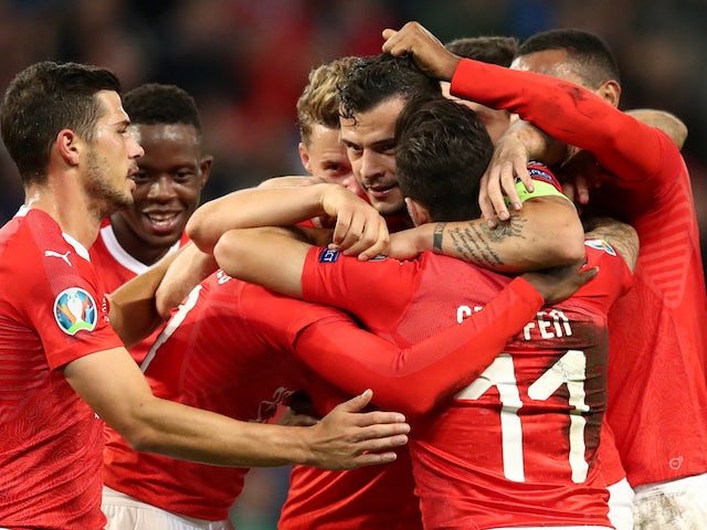 Switzerland's Edimilson Fernandes celebrates scoring their second goal with Granit Xhaka and team mates on October 15, 2019