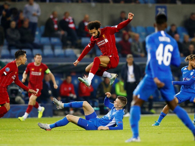 Mohamed Salah jumps over Bryan Heynen during the Champions League game between Genk and Liverpool on October 23, 2019