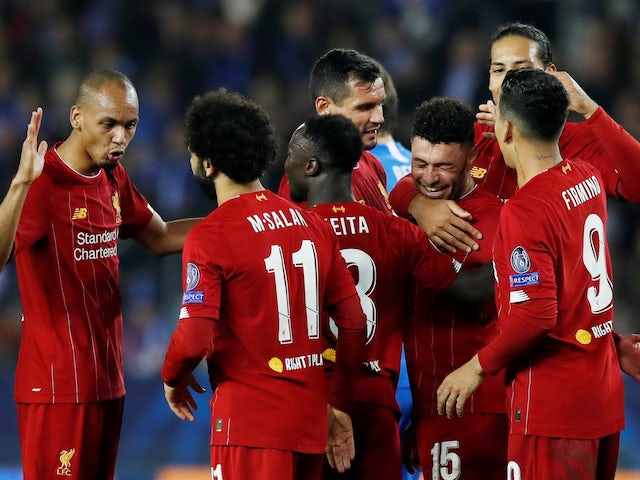 Alex Oxlade-Chamberlain is mobbed by teammates after getting the second during the Champions League game between Genk and Liverpool on October 23, 2019