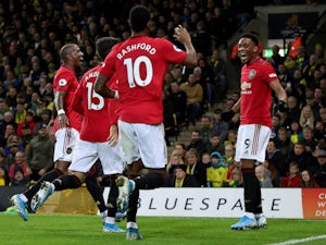 Manchester United's Anthony Martial celebrates scoring their third goal with team mates on October 27, 2019