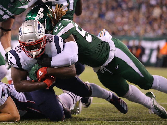 New England Patriots running back Sony Michel (26) dives for a touchdown against New York Jets linebacker C.J. Mosley (57) during the second quarter at MetLife Stadium on October 22, 2019