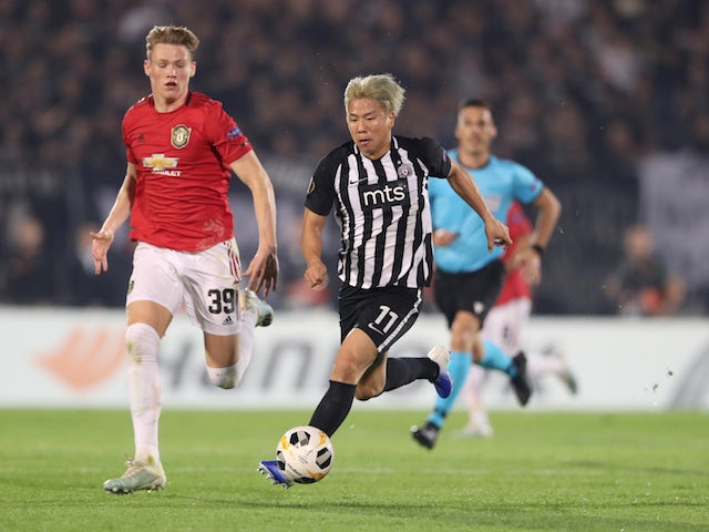 Manchester United's Scott McTominay in action with Partizan Belgrade's Takuma Asamo in the Europa League on October 24, 2019