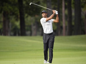 Tiger Woods on course for PGA Tour record as he takes lead in Japan