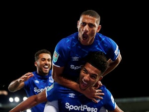 Everton's Mason Holgate celebrates scoring their first goal with Richarlison on October 29, 2019