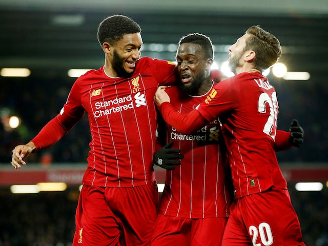 Liverpool's Divock Origi celebrates scoring their fifth goal with teammates Joe Gomez and Adam Lallana on October 30, 2019