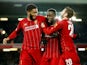 Liverpool's Divock Origi celebrates scoring their fifth goal with teammates Joe Gomez and Adam Lallana on October 30, 2019