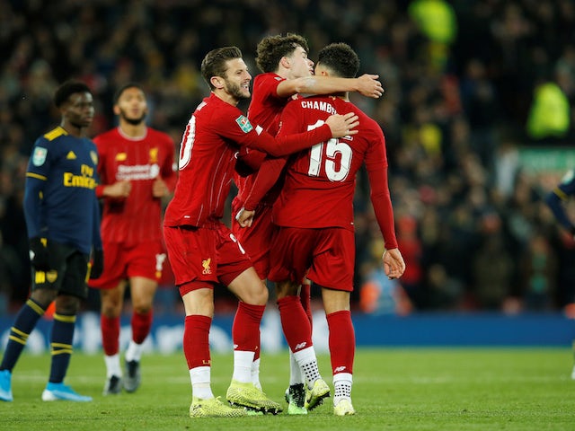 Liverpool's Alex Oxlade-Chamberlain celebrates scoring their third goal with teammates on October 30, 2019