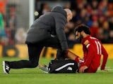 Liverpool's Mohamed Salah receives medical attention after sustaining an injury on October 27, 2019