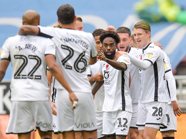 Swansea City's Nathan Dyer celebrates scoring their first goal with teammates