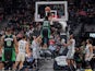 Boston Celtics center Robert Williams III (44) dunks the ball over San Antonio Spurs guard Derrick White (4) and forward LaMarcus Aldridge (12) during the second half at the AT&T Center on November 10, 2019.