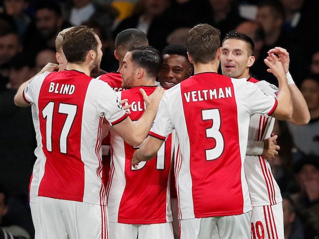 Ajax's Quincy Promes celebrates scoring their first goal with teammates on November 5, 2019