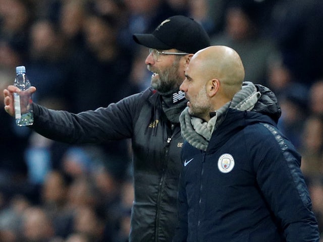 Manchester City manager Pep Guardiola and Liverpool manager Juergen Klopp talk to each other during the match in January 2019