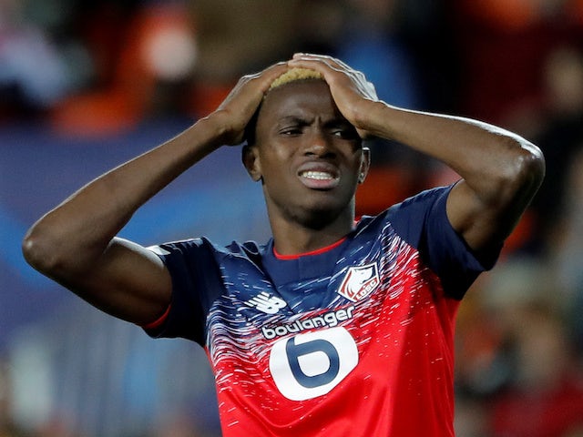 Lille's Victor Osimhen looks dejected after Valencia's Dani Parejo scores their first goal on November 5, 2019
