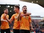 Wolverhampton Wanderers' Ruben Neves celebrates scoring their first goal with Leander Dendoncker and Matt Doherty on November 10, 2019