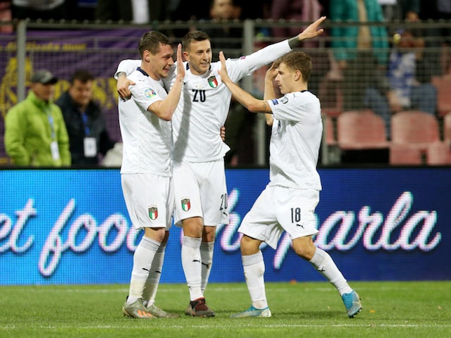  Italy's Andrea Belotti celebrates scoring their third goal with Federico Bernardeschi and Nicolo Barella on November 15, 2019
